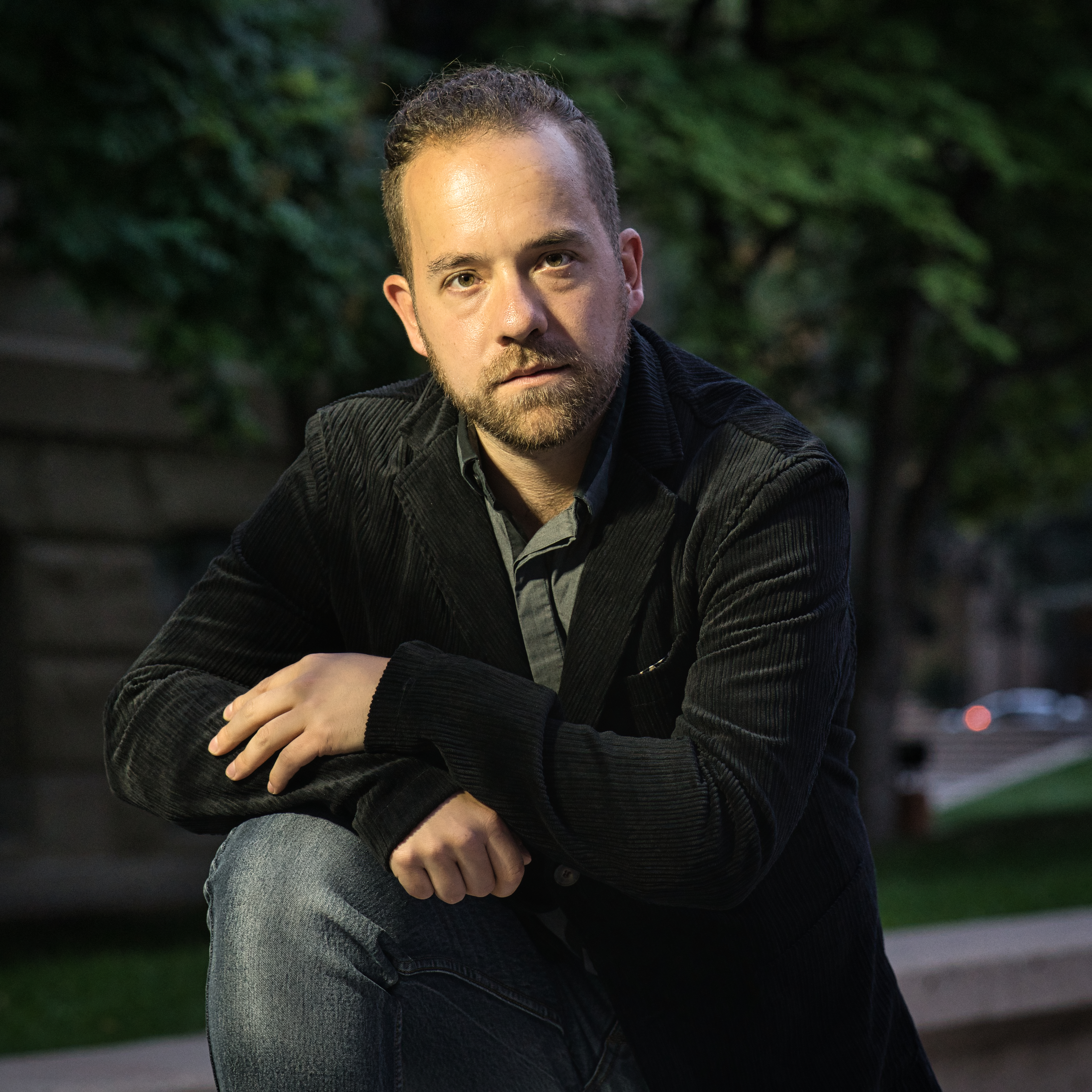 Sean Gore in Suit Jacket Leaning in